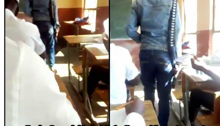 Teacher suspended for invigilating exams with a gun