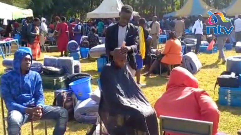 Kereri Girls Form One being given a clean shave