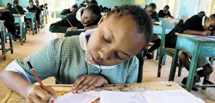 KCPE candidate sitting for her examination