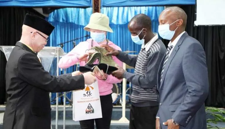 Isaac Mwaura Handing Over Shopping From ASK To Winnie Jelimo