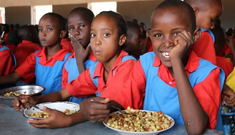School Chidren Enjoying A Meal